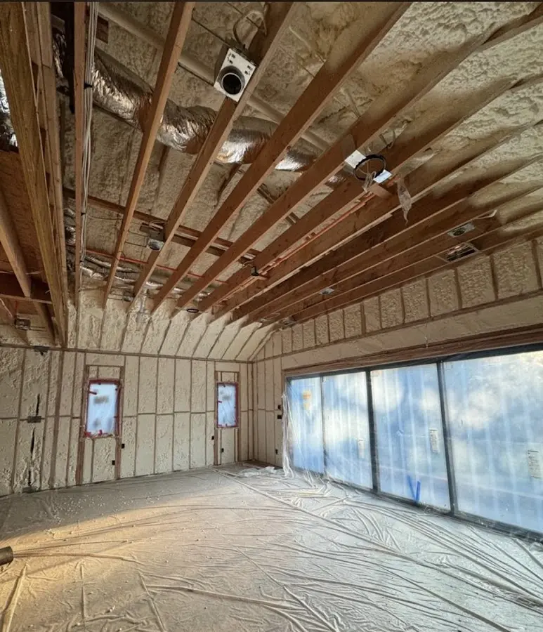 Interior walls and ceiling insulated with spray foam during new construction in Anoka